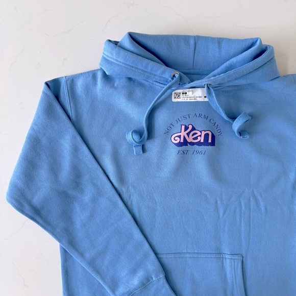 Mattel Creations Barbie Signature Kencore™ Not Just Arm Candy Unisex Hoodie - Picture 1 of 9